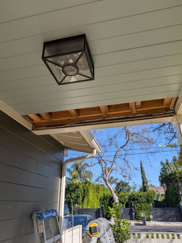 Ceiling opened to expose wooden beams for safe porch swing installation in Silver Lake