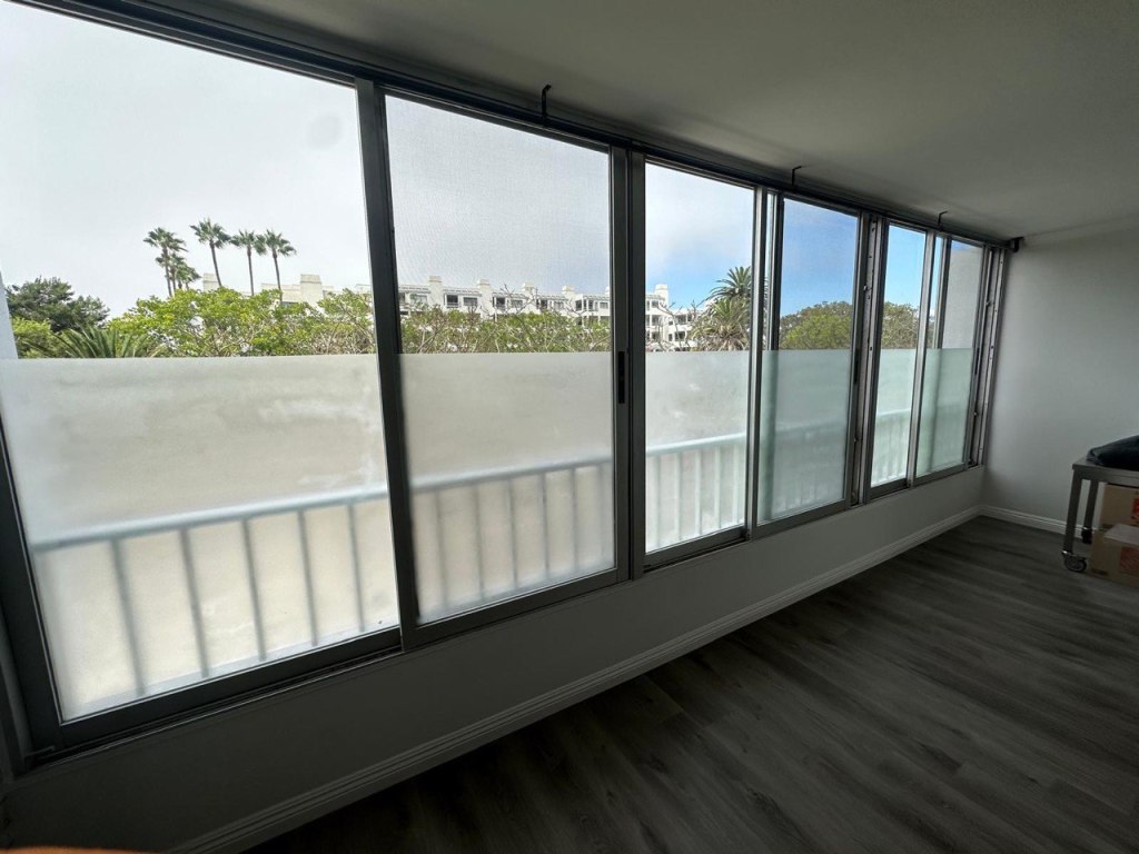 Frosted privacy window film installed on large apartment windows in Venice